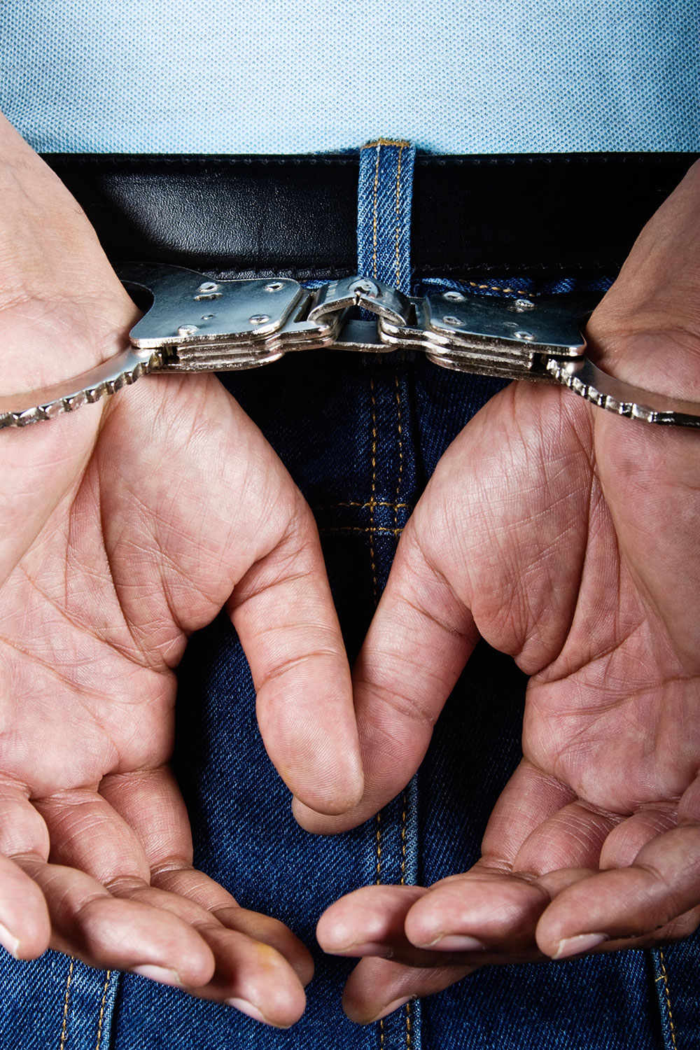 man arrested with handcuffs